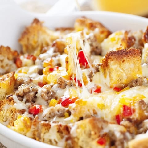 Freshly baked Breakfast Sausage Casserole with golden bread cubes, savory sausage, and melted cheddar cheese straight from the oven.